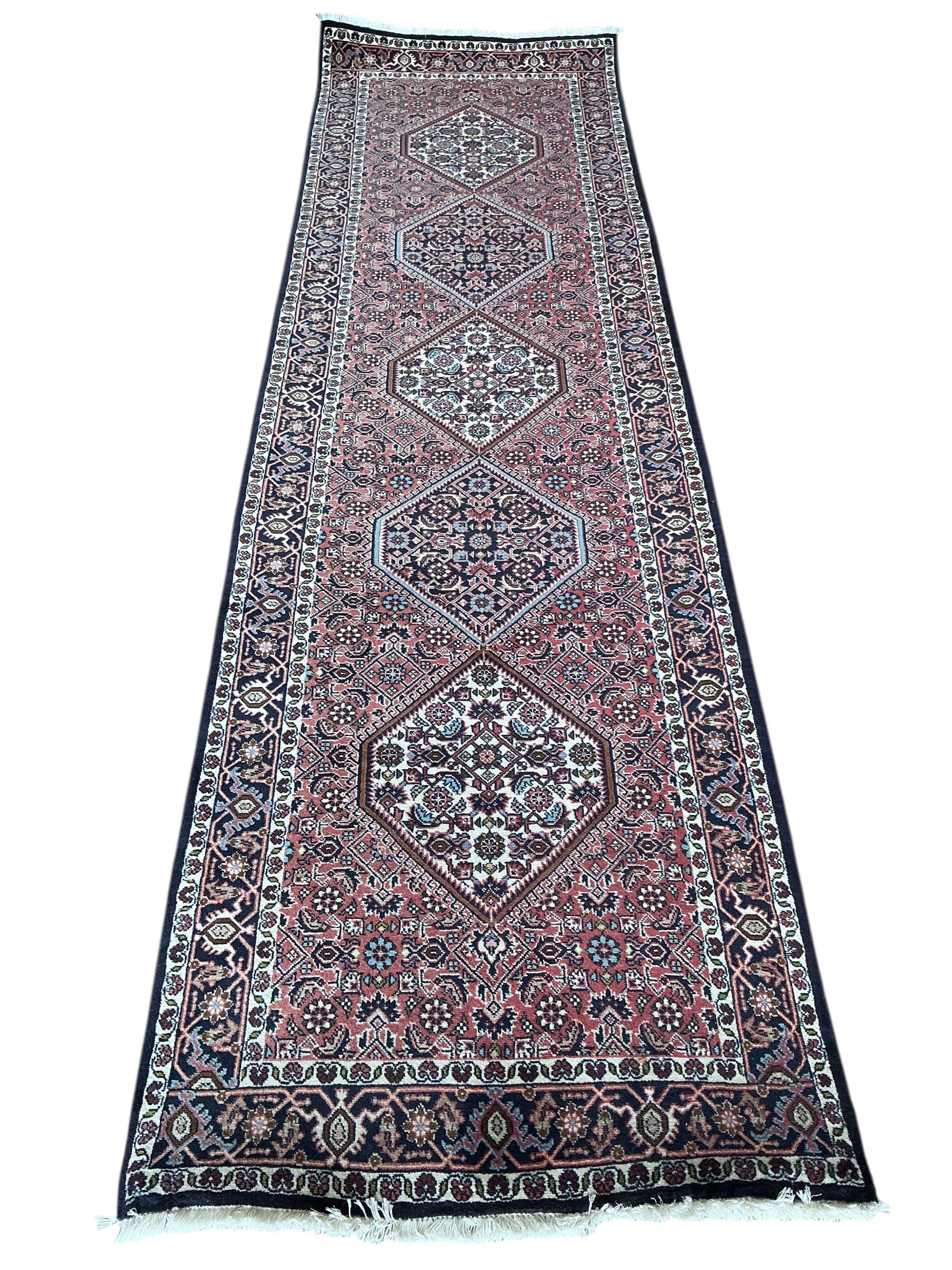 A Bijar red ground runner, approx. 295 x 83cm